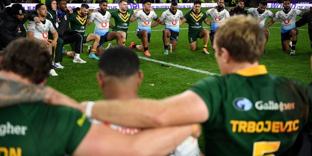 Australia and Fiji players sing together after Rugby League World Cup 2021 Pool B match between Australia and Fiji at Headingley on October 15, 2022, in Leeds, England.