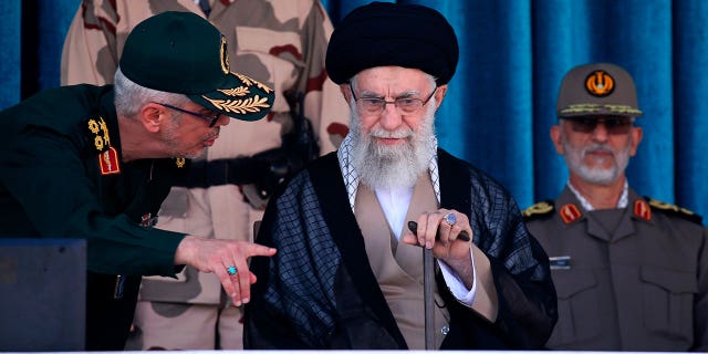 Iran;s Supreme Leader Ayatollah Ali Khamenei, center