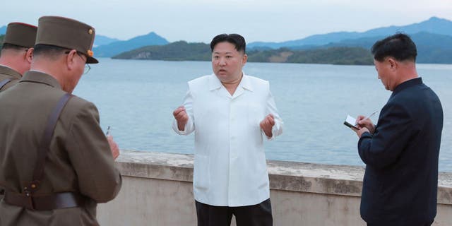 North Korean leader Kim Jong-un speaks at an undisclosed location in North Korea in this photo released by North Korea's Korean Central News Agency (KCNA) on October 9, 2022. 