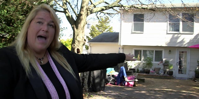 BJ Dowlen explaining how her property was flooded by a storm surge during Superstorm Sandy in 2012.