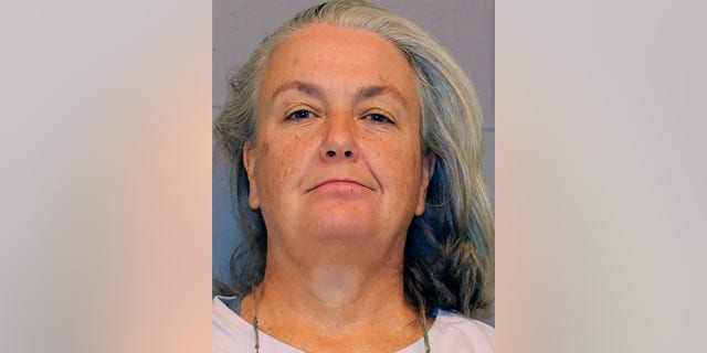 This booking photo provided Hampden County Sheriff's Department shows Rorie S. Woods, 55, of Hadley, Mass., Wednesday, Oct. 12, 2022, at Western Massachusetts Regional Women's Correctional Center, in Chicopee, Mass.