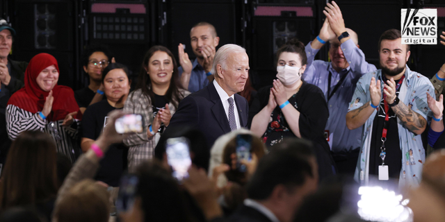 Joe Biden greets employees of an IBM facility.