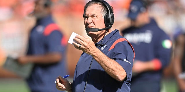 New England Patriots head coach Bill Belichick watches as his team plays against the Cleveland Browns during the second half of an NFL football game, Sunday, Oct. 16, 2022, in Cleveland. 