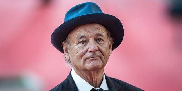 bill murray wears hat and bow tie on red carpet