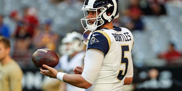 Los Angeles Rams quarterback Blake Bortles, #5, spins the ball before the NFL football game between the Los Angeles Rams and the Arizona Cardinals on Dec. 1, 2019 at State Farm Stadium in Glendale, Arizona.