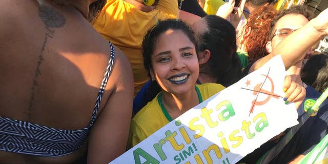 Supporters gather for President Jair Bolsonaro's final campaign rally days before Brazil's presidential election.