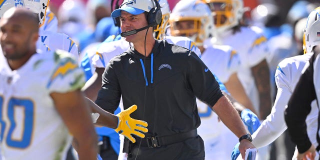 Chargers head coach Brandon Staley celebrates with the team after Los Angeles scored a touchdown against the Cleveland Browns, Sunday, Oct. 9, 2022.
