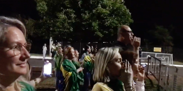 Brazilians gather after the first round of the presidential election.  Jair Bolsonaro and Lula were forced into the runoff vote.