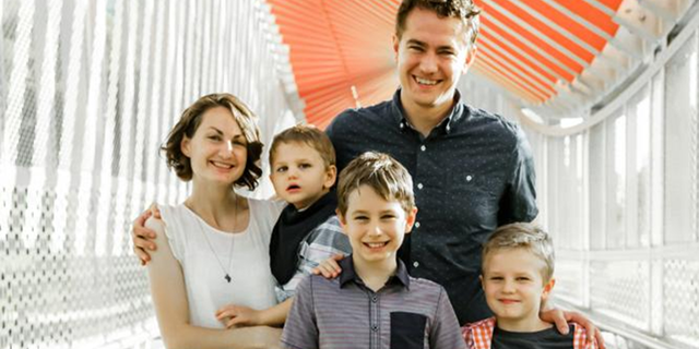 Brett Stelmaszek, his wife, Sydney, and their children, Emmitt, Isaac and Judah.