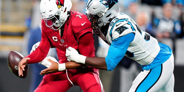 Carolina Panthers defensive end Brian Burns tackles Arizona Cardinals quarterback Kyler Murray during the second half of an NFL football game on Sunday, Oct. 2, 2022, in Charlotte, N.C.