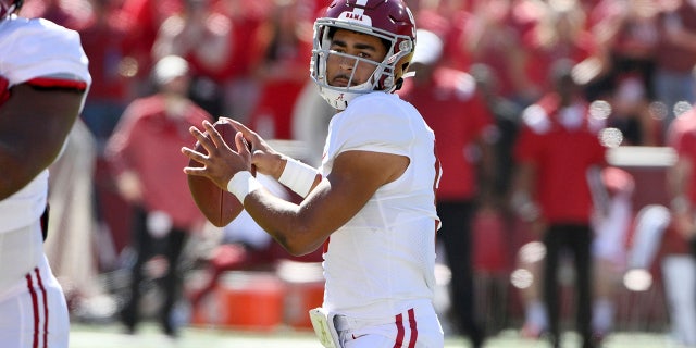 Alabama quarterback Bryce Young (9) drops back to pass against Arkansas during the first half of an NCAA college football game Saturday, Oct. 1, 2022, in Fayetteville, Ark. 