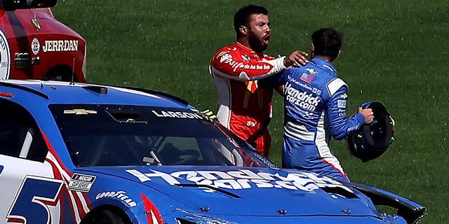 Bubba Wallace, driver of the #45 McDonald's Toyota, pushes Kyle Larson, driver of the #5 HendrickCars.com Chevrolet, after an on-track incident during the NASCAR Cup Series South Point 400 at Las Vegas Motor Speedway on October 16, 2022, in Las Vegas, Nevada.