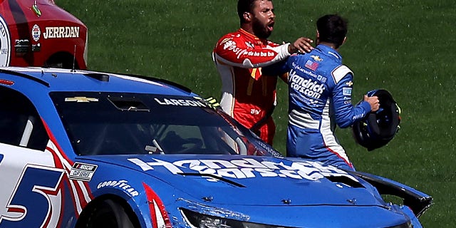 Bubba Wallace, driver of the #45 McDonald's Toyota, pushes Kyle Larson, driver of the #5 HendrickCars.com Chevrolet, after an on-track incident during the NASCAR Cup Series South Point 400 at Las Vegas Motor Speedway on October 16, 2022, in Las Vegas, Nevada.