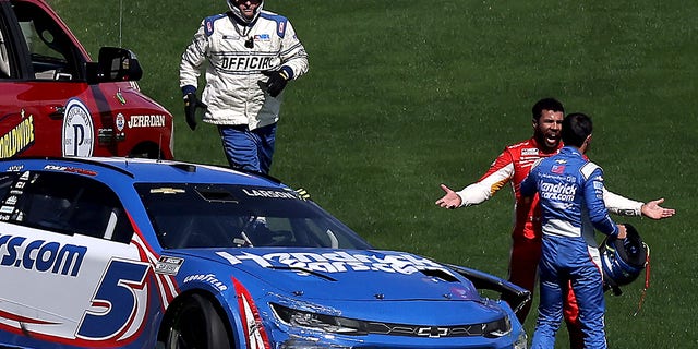 Bubba Wallace, driver of the #45 McDonald's Toyota, confronts Kyle Larson, driver of the #5 HendrickCars.com Chevrolet, after an on-track incident during the NASCAR Cup Series South Point 400 at Las Vegas Motor Speedway on October 16, 2022 in Las Vegas, Nevada.