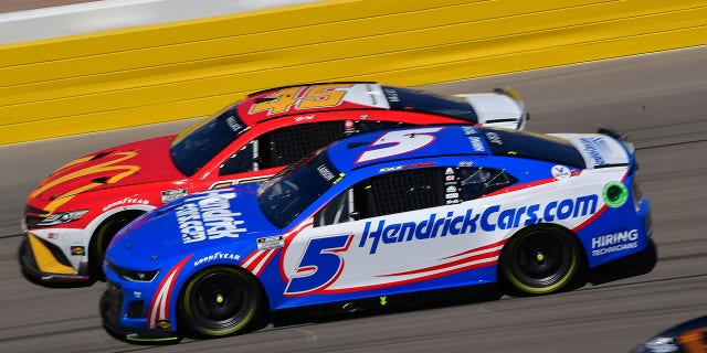Oct 16, 2022; Las Vegas, Nevada, USA; NASCAR Cup Series driver Kyle Larson (5) and driver Bubba Wallace (45) drive for position during the South Point 400 at Las Vegas Motor Speedway.
