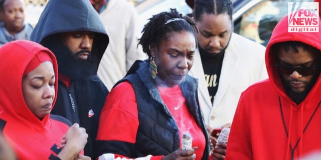 Mays mourns the loss of her son, Booka, at a local vigil after his death in 2019.