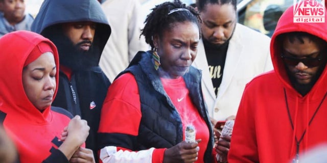 Mays mourns the loss of her son, Booka, at a local vigil after his death in 2019.