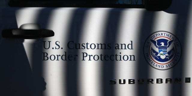 NOGALES, AZ - DECEMBER 09: A U.S. Border Patrol vehicle sits parked next to the U.S.-Mexico border fence on December 9, 2014, in Nogales, Arizona. 