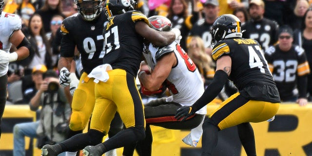 Cameron Brate was injured on the play and taken off the field on a cart.