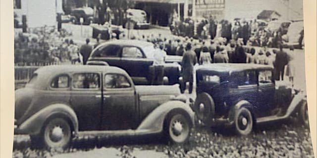 Locals gather outside the building currently occupied by the Centermoreland Grocery and Deli, year unknown. The original photograph is held by the Weidners and was gifted by a member of the community.