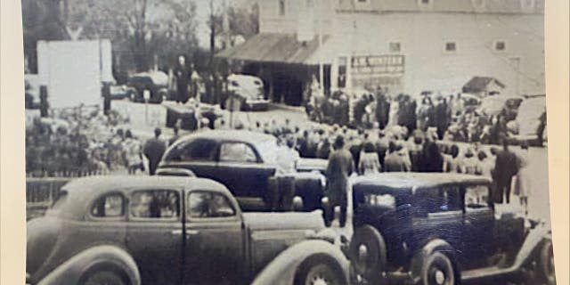 Locals gather outside the building currently occupied by the Centermoreland Grocery and Deli, year unknown. The original photograph is held by the Weidners and was gifted by a member of the community.