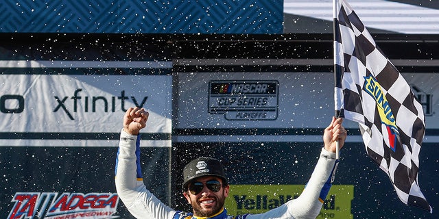 Chase Elliott, driver of the No. 9 NAPA Auto Parts Chevrolet, celebrates in victory lane after winning the YellaWood 500 at Talladega Superspeedway on Oct. 2, 2022, in Talladega, Alabama.