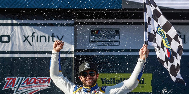 Chase Elliott, driver of the No. 9 NAPA Auto Parts Chevrolet, celebrates in victory lane after winning the YellaWood 500 at Talladega Superspeedway on Oct. 2, 2022, in Talladega, Alabama.
