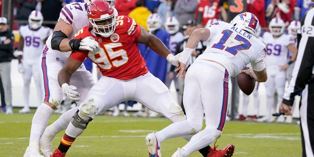 Kansas City Chiefs defensive tackle Chris Jones (95) seems to trip Buffalo Bills quarterback Josh Allen during the second half on Oct. 16, 2022, in Kansas City.