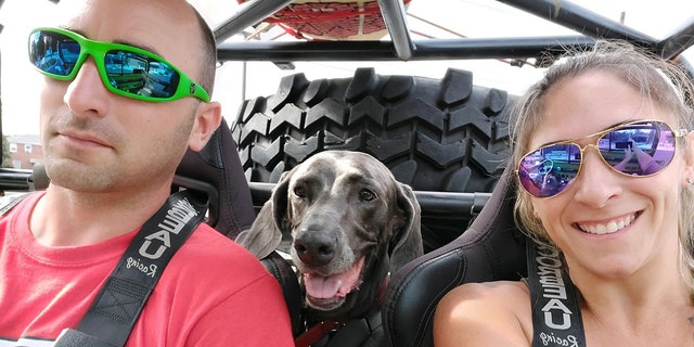 TJ Foley is pictured with his wife Christina and their dog. Foley lost vision in his left eye after a bench grinder machine exploded on Oct. 1, 2022.