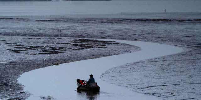 Clam fisherman boating