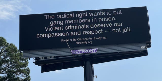 Billboard in Atlanta showing a satirical ad mocking progressive ideals.