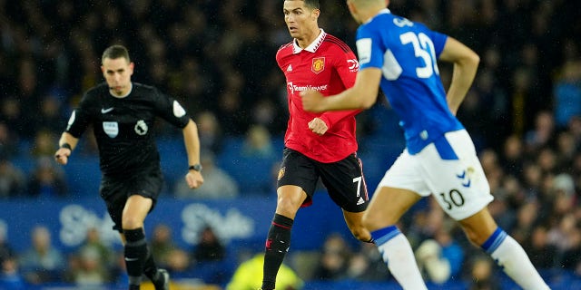 Manchester United's Cristiano Ronaldo runs with the ball during a Premier League soccer game against Everton at Goodison Park, in Liverpool, England, Sunday, Oct. 9, 2022.