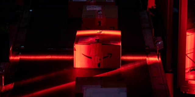 Packages move along a conveyor at an Amazon fulfillment center on Cyber Monday in Robbinsville, N.J., Nov. 29, 2021.