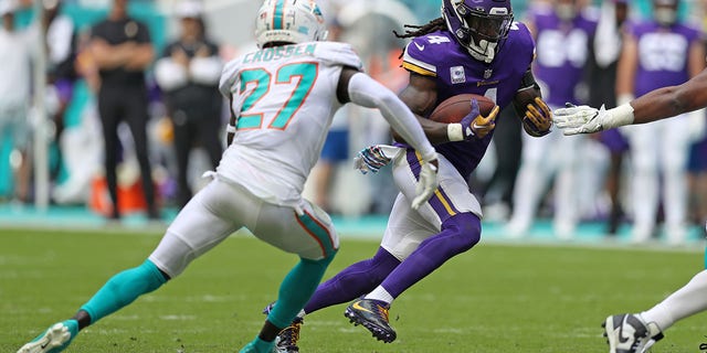 Dalvin Cook, #4 of the Minnesota Vikings, runs against the Miami Dolphins during the first half at Hard Rock Stadium on Oct. 16, 2022 in Miami Gardens, Florida.