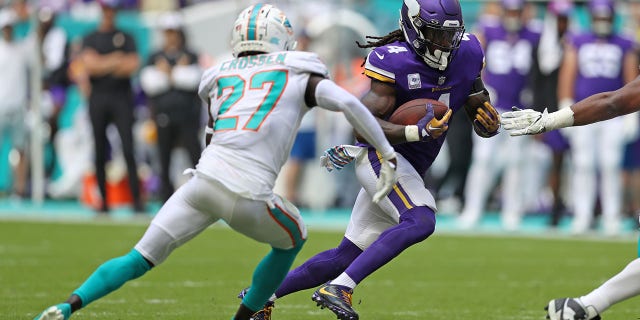 Dalvin Cook, #4 of the Minnesota Vikings, runs against the Miami Dolphins during the first half at Hard Rock Stadium on Oct. 16, 2022 in Miami Gardens, Florida.