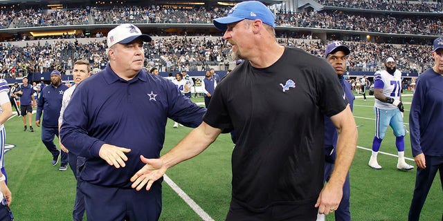 Detroit Lions head coach Dan Campbell, right, greets Dallas Cowboys head coach Mike McCarthy after an NFL football game, Sunday, Oct. 23, 2022, in Arlington, Texas. 