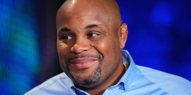 Daniel Cormier is seen in the broadcast booth during the UFC 280 event at Etihad Arena on Oct. 22, 2022 in Abu Dhabi, United Arab Emirates.