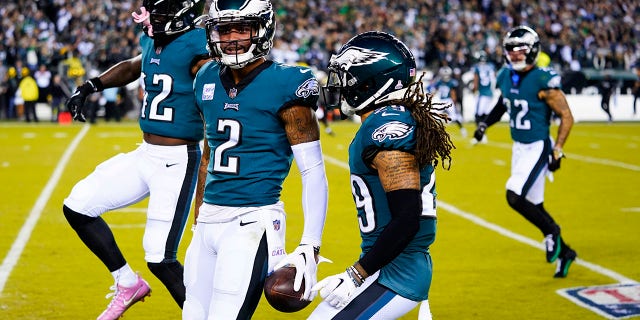 Eagles' Darius Slay celebrates his interception against the Dallas Cowboys on Oct. 16, 2022, in Philadelphia.