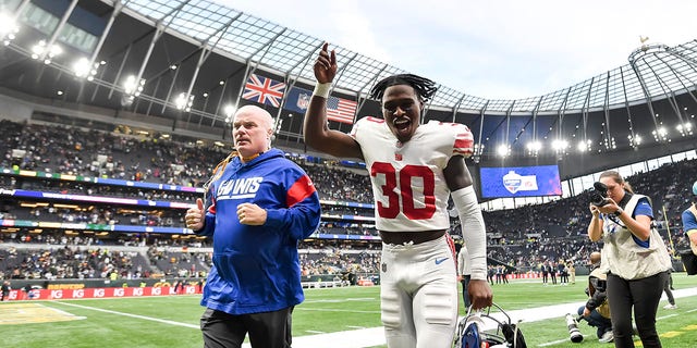 Darnay Holmes celebrates after the oNew York Giants beat the Green Bay Packers at Tottenham Hotspur Stadium on Oct. 9, 2022, in London.