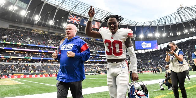 Darnay Holmes celebrates after the oNew York Giants beat the Green Bay Packers at Tottenham Hotspur Stadium on Oct. 9, 2022, in London.
