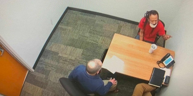 An image of the interrogation of Darrell Brooks Jr. following last year's Waukesha Christmas parade attack.