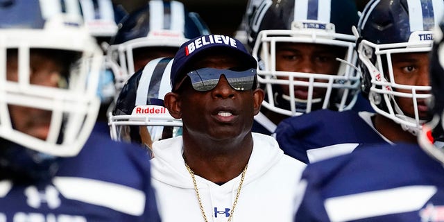 Jackson State Tigers head coach Deion Sanders enters the field with his team prior to the start of a game against the Florida A and M Rattlers at Hard Rock Stadium.