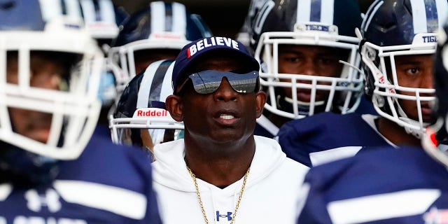 Jackson State Tigers head coach Deion Sanders enters the field with his team prior to the start of a game against the Florida A and M Rattlers at Hard Rock Stadium.