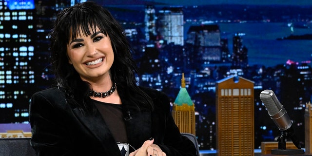Demi Lovato claims her childhood home in Texas is haunted by a girl named Emily who is around 11 or 12.