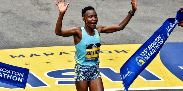 Diana Kipyogei of Kenya crosses the finish line to take first place in the professional women's division during the 125th Boston Marathon in Boston Oct. 11, 2021.