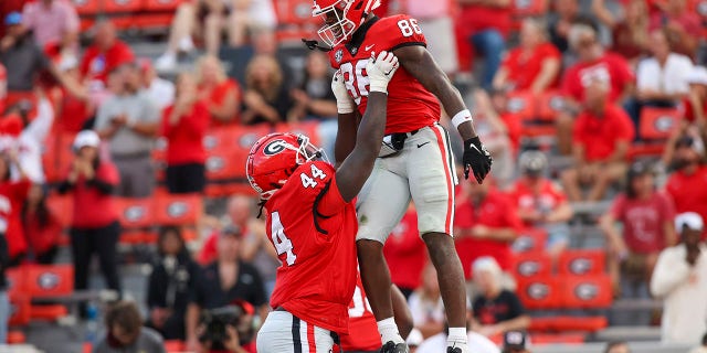 Georgia wide receiver Dillon Bell (86) celebrates after a touchdown with defensive lineman Zion Logue (44) in the second half of an NCAA college football game against Vanderbilt, Saturday, Oct. 15, 2022, in Athens, Ga.