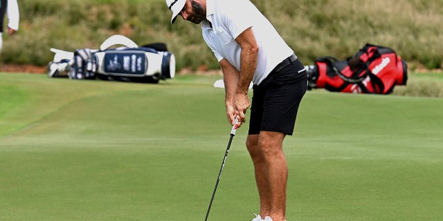 Dustin Johnson plays a shot during LIV Golf Invitational Bangkok at Stonehill Golf Club in Pathum Thani, Thailand, Friday, Oct. 7, 2022.