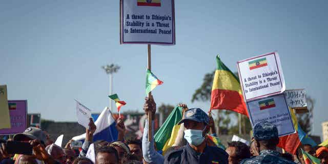 Ethiopians protest against what they say is interference by outsiders in the country's internal affairs and the Tigray People's Liberation Front at a rally organized by the city administration in Addis Ababa, Ethiopia, on Oct. 22, 2022.