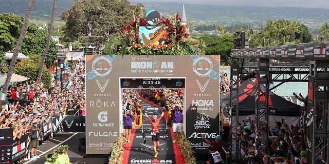 Chelsea Sodaro celebrates after winning the IRONMAN World Championships on Oct. 6, 2022, in Kailua Kona, Hawaii.