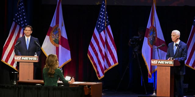 Ron DeSantis, governor of Florida, and Charlie Crist, Democratic gubernatorial candidate for Florida, during the Florida gubernatorial debate in Fort Pierce, Florida, US, on Monday, Oct. 24, 2022.